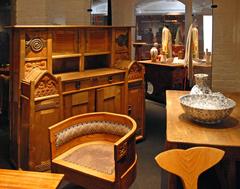 Finnish Art Nouveau furniture from early 20th century, including chair from 1903, table from 1905, and Arabia ceramics from 1910, with a cupboard by Valter Jung from 1903