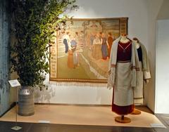 Tapestry by Vivi Dahlberg-Munsterhjelm, 1904 showing traditional Finnish costumes in the Design Museum's historical gallery