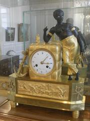 Bronze clock depicting a young black man loading a cotton bale, Musée du Nouveau Monde