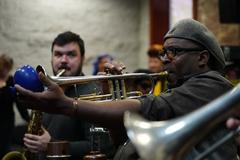 Trumpet player's expressive performance at New Orleans Jazz National Historical Park