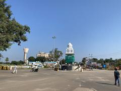 street view in Hospet, India, with people walking and motorbikes parked on the sides