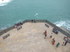 Kanyakumari sea view with clear blue sky and waves crashing on the rocks