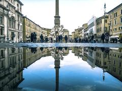 Reflections on water puddles on cobblestone