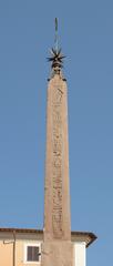 Obelisk of the Pantheon in Rome with intricate carvings and inscriptions, set against a clear blue sky