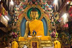 Large Buddha image in lotus position inside Tawang Monastery's Dukhang