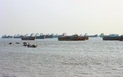 Fishing trawlers and harbor ships near Patenga sea beach