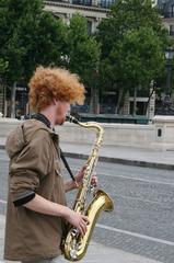 Saxophonist playing on the Pont Neuf in Paris