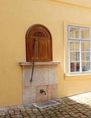 Palffy Palace courtyard with historical water pump in Prague