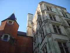 a street in Lille with historical buildings and people