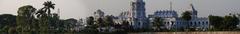 Agartala cityscape with greenery and buildings under a cloudy sky