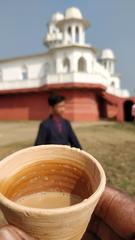 Neermahal palace with people having tea outside