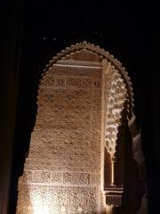 Alhambra fortress illuminated at night in Granada, Spain