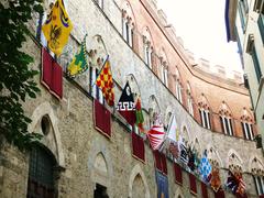 Palazzo Chigi-Saracini in Siena with contrade flags