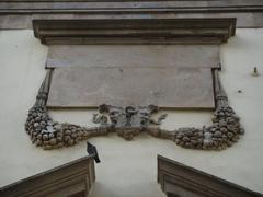 stone mask on the facade of Palazzo Ducale in Lucca