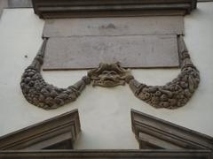 stone face sculpture on Palazzo Ducale in Lucca