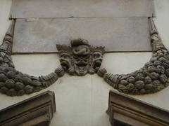 stone mask sculpture on Palazzo Ducale in Lucca