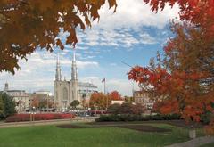 View of Major's Hill Park with flowers, green lawns, and a scenic tea house