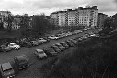 Sinebrychoffin puisto with parked cars and residential buildings in the background