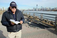 FEMA Mitigation Specialist assessing damages to Liberty State Park walkway after Hurricane Sandy in Jersey City