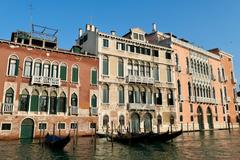 a beautiful canal in Venice with gondolas and historical buildings