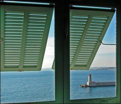 View of the pier in Nice harbor and the Bay of Angels from a window of the grand seminary