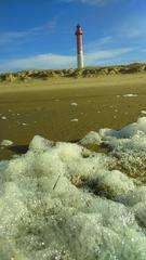 Phare de la Coubre with beach foam at La Tremblade