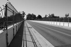 El Prado in Balboa Park with shadow cast on the walkway facing west