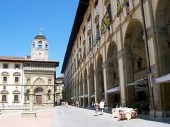 Arezzo Piazza Grande with historical buildings and a cloudy sky