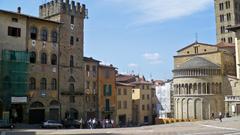 Arezzo cityscape view from a high vantage point showing historical buildings and lush greenery