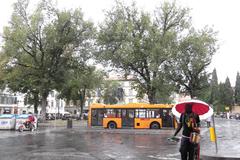 Wet Florence and the 'Wet Florentine' sculpture in the rain