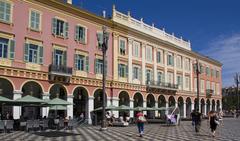 Jean-Médecin street in Nice, France with buildings and people