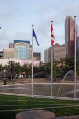 Calgary Olympic Square in downtown Calgary with surrounding buildings and clear blue sky