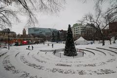 people skating at Olympic Plaza in Calgary on a winter day