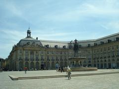 Scenic view of Bordeaux city streets with historic architecture and pedestrians, taken in July 2012