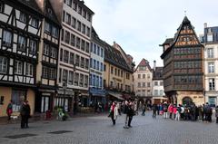 A bridge over the Ill River in Strasbourg with traditional half-timbered houses