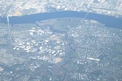 Oblique view of Pennsauken Creek in New Jersey flowing into the Delaware River with Betsy Ross Bridge in the background.