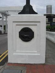 Crest of the Singapore Municipal Commission at one end of Elgin Bridge in Singapore