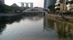 Elgin Bridge and Singapore River with Parliament House and Marina Bay Sands Hotel in the background