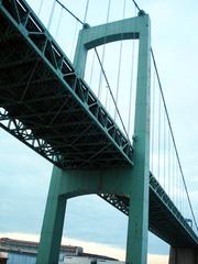 scenic bridge spanning a waterway with lush greenery