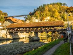 Covered wooden bridge over the Saane River in Fribourg, Switzerland