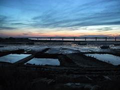 Viaduc de l'Île d'Oléron at sunset with oyster culture in marshes