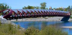 Peace Bridge over Bow River in Calgary, Alberta with cyclists and pedestrians