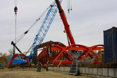 Segments of Peace Bridge being assembled on the banks of the Bow River, Calgary, October 2010