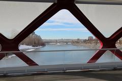 Peace Bridge in winter with snow and sunlight in Calgary