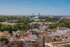 Rooftops and bridges over Guadalquivir River in Seville, Spain