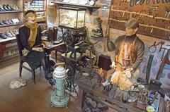 Cobbler at work with a client in Rahmi M. Koç Museum, Istanbul