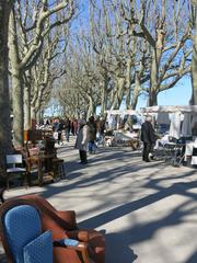 A lively Sunday market in Montpellier with various stalls and people browsing