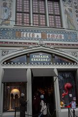 interior of Livraria Lello, ornate staircase and bookshelves