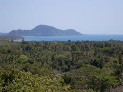 Scenic landscape of Thailand with green hills and cloudy sky