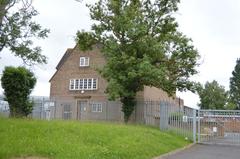 A44 roadside view with a path, wooden fence, and lush greenery